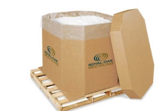 Recycling and packaging supplies, featuring a large cardboard container on a wooden pallet branded with Royal Oak Recycling.