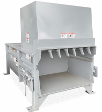 Gray industrial recycling equipment designed for shredding and processing recyclable materials efficiently.