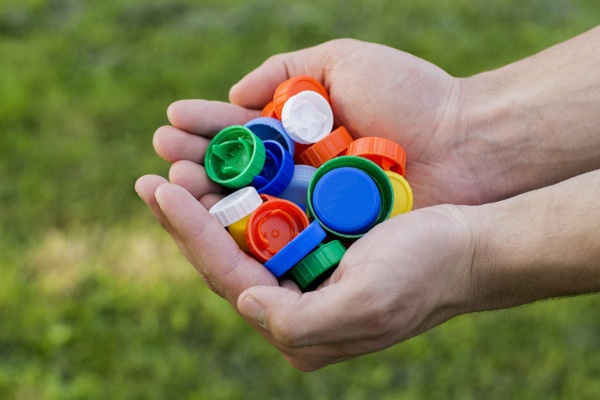 Plastic bottle cap recycling on sale program