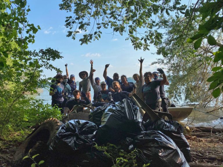 Volunteers showing off more waste they have removed